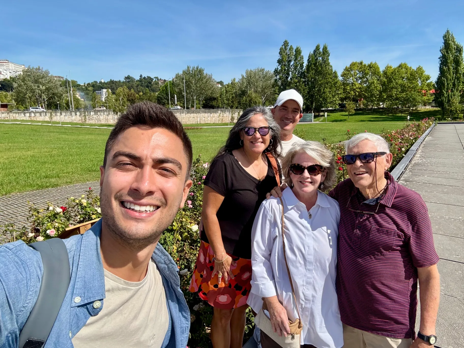 Mateus with tourists at a viewpoint in Coimbra during a private tour
