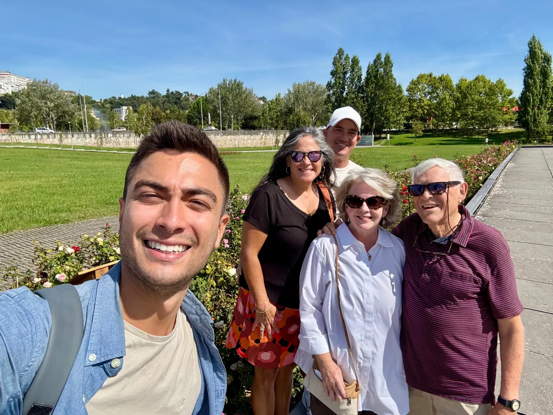 Mateus with tourists at a viewpoint in Coimbra during a private tour