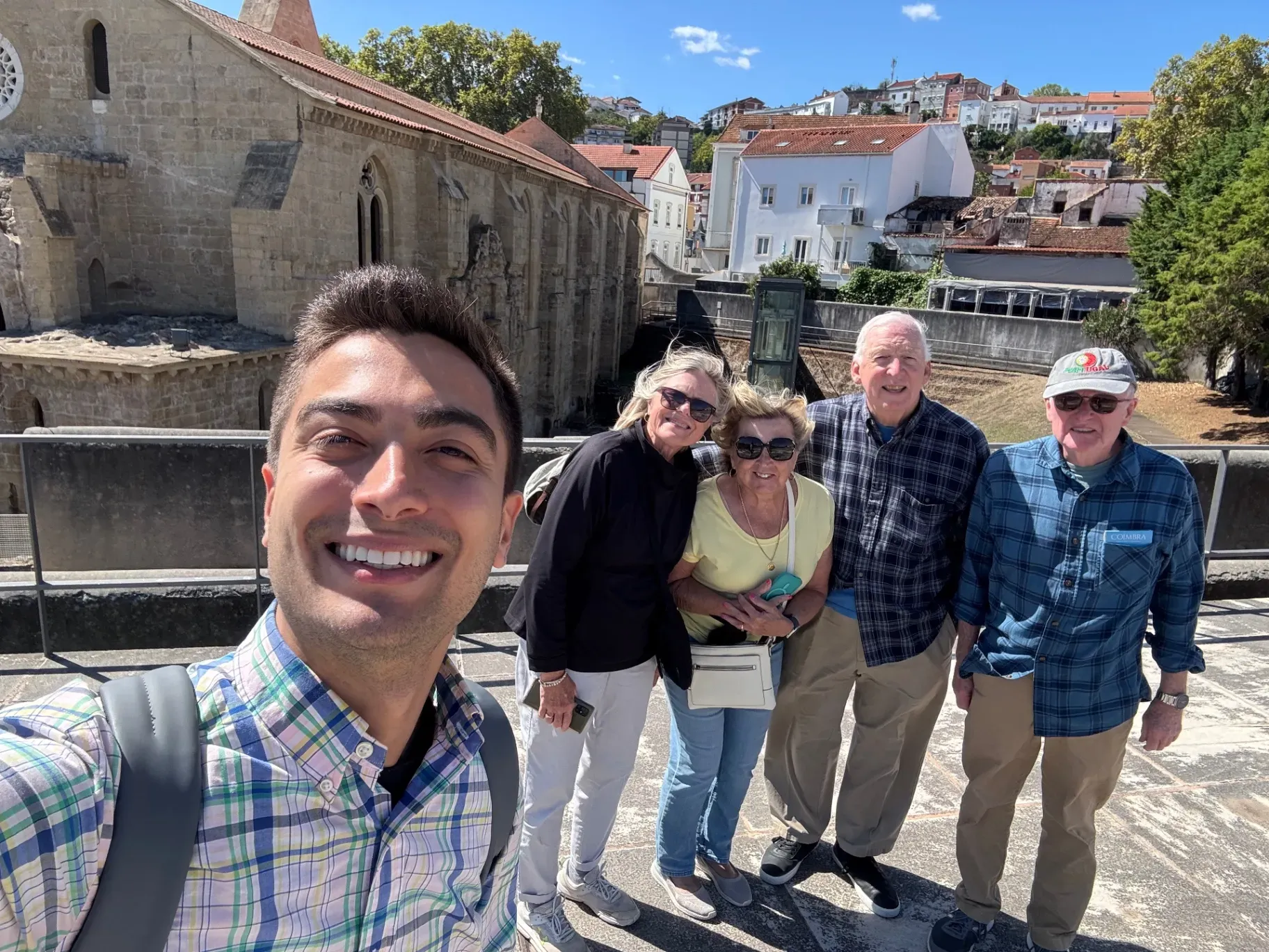 Mateus exploring historic streets of Coimbra with guests